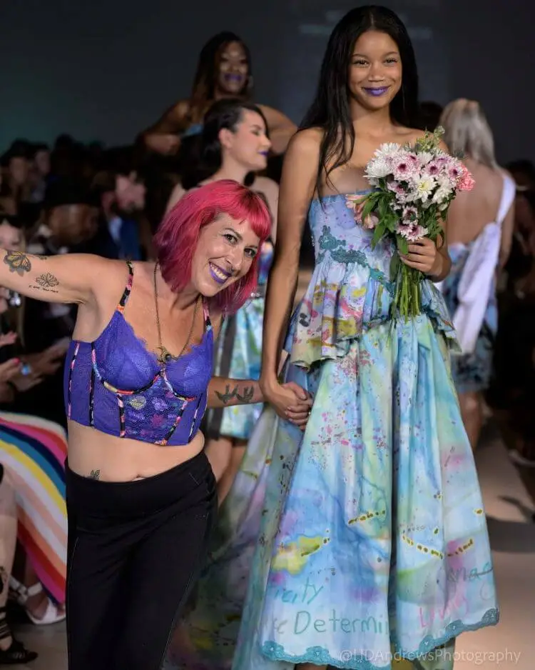 Fashion Designer Melissa Crosson with a model at a runway show.